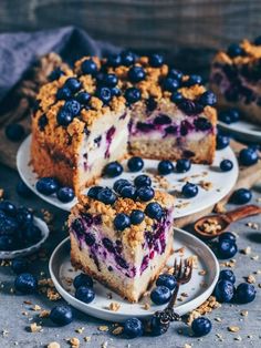 blueberry crumb cake on plates with one slice cut out