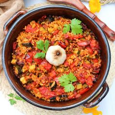 a large pot filled with lots of food on top of a table