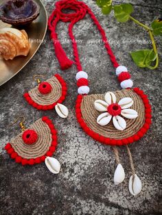 the necklace and earrings are made out of straw with shells on it, along with seashells