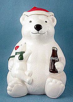 a white polar bear holding a beer bottle