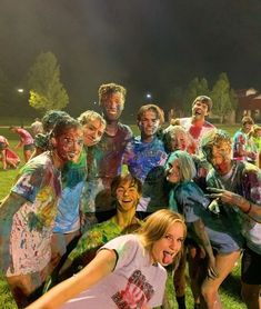 a group of people covered in colored paint