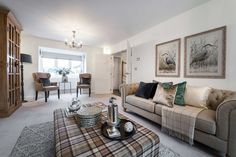 a living room filled with furniture and decor