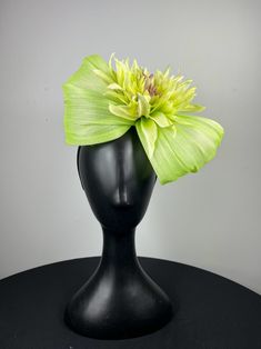 Lime green pinopok shaped and accented with a beautiful lime dahlia. Sits on a comfortable black headband. Lightweight and easy to wear. Ships in a high quality storage box. One of a kind.  Perfect for Kentucky Derby, Royal Ascot, church, weddings, just for fun. Adjustable Green Summer Fascinator, Spring Adjustable Green Fascinator, Fitted Green Headband For Summer, Green Summer Fascinator With Handmade Flowers, Green Spring Party Hair Accessories, Elegant Green Hair Accessories For Kentucky Derby, Elegant Fitted Green Headband, Green Fascinator With Handmade Flowers For Spring, Green Spring Fascinator With Handmade Flowers