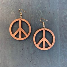 Unique Peace Sign Hippie/Boho wood earrings that are made out of beautiful dark stained birch wood with brass hooks hooks. These are a part of our Classic Wood Collection.These are very trendy and truly unique earrings. Wood circle measures approximately 2" Wood Peace Sign, Shed Designs, Red Shed, Peace Earrings, Natural Bohemian, Wood And Concrete, Faux Brick Walls, Concrete Jewelry, Brass Hooks