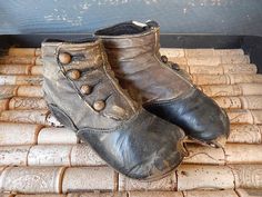 A rare find!  A pair of late 18th century child's shoes/boots from the Victorian era!  These 4 button boots are hand made from brown leather and measure 5 3/4" long. They stand approximately 3" high. Wonderful for your collection of historical clothing.  They were obviously well loved and used and show wear and tear.  Enlarge your screen to get a good look at the details and character of this charming pair.  Feel free to message me with any questions. Victorian Shoes Women, Victorian Shoes, Button Boots, Weird Fish, Shoes Brown, Historical Clothing, Antique Victorian, Victorian Era, Costume Design