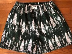 "ATTENTIONWE ARE AT FULL CAPACITY FOR  DELIVERY BY CHRISTMAS FOR 2023 . You can still place an order, however..we can not guarantee that it will ship, or that you will  receive it by Christmas Day!One pair of Christmas Forest Green Tree and Deer Flannel Pajama shorts! You can finding matching pants here:   https://www.etsy.com/listing/1537638851/olde-time-christmas-collection-flannel?click_key=3c0336569d5725afbe09156084f9d986dd76c121%3A1537638851&click_sum=c3885b89&ref=shop_home_active_6&frs=1&sts=1 -100% flannel - Handmade in the USA by me in Virginia -  1/2\"  elastic waist with/wo decorative bow (the elastic is not adjustable like the matching pants) - contrast fabric edging on the hem    How do you find your size?????   measure your hips and then look at the size chart, the hips are th Cheap Green Pajama Shorts, Cheap Green Sleep Bottoms, Christmas Pajamas Shorts, Green Pajama Shorts, Christmas Pants Pjs Shorts, Dark Green Plaid Pajamas, Christmas Pants Pjs Shortd, Christmas Pajama Shorts, Shorts Pjs