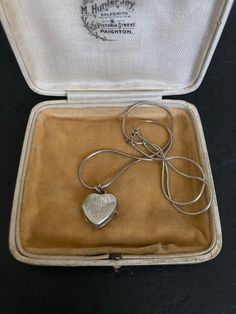 Beautiful 1970s VINTAGE SILVER Locket on a sterling silver 16 inch Chain. A lovely heart shaped Sterling Silver Engraved Pendant Necklace. 70s Vintage Silver Jewelry offered by Isobel Vintage Jewels on Etsy Style: Vintage 1970s real silver locket. A lovely heart 70s side opening sterling silver locket big enough for putting little photos inside.  Colour: silver  Size: 1.5 x 1.5 cm and 16 inch chain Condition: Excellent condition Approximate Date: 1970s Check out my other lovely silver items including this one: https://www.etsy.com/uk/listing/1269638336/70s-sterling-silver-ring-pretty-delicate Please note: ALL the items in my shop are vintage and have been previously worn. Items will show wear commensurate with their age and any major flaws will be noted and I really only sell items that ar Vintage Hallmarked White Gold Locket Necklace, Vintage Jewelry Collectible With Hallmark, Vintage Collectible Jewelry With Hallmark, Victorian Hallmark Jewelry For Memorial, Vintage Necklaces For Valentine's Day Memorial, Vintage Necklace For Valentine's Day Memorial, Victorian Memorial Jewelry With Hallmark, Vintage Sterling Silver Jewelry For Anniversary, Vintage Jewelry For Anniversary