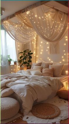 a white bed with lights on the headboard and canopy over it in a bedroom