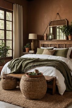 a large bed sitting next to a window with potted plants on top of it