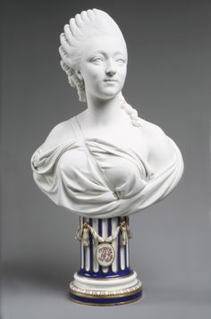 a statue of a woman in white and blue