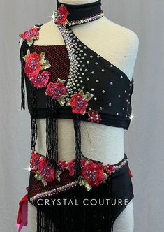 a black and red top with flowers on it