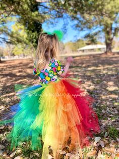 This high low tutu is next level. The front is an Ombre green and topped with a shiny gold bow. The back is over 100 yards of tulle with tiered layers creating a wild rainbow look. The back layers have glitter tulle mixed in. Sizing Info: 1-3T is roughly 6" long in the front, 20" long in the back 4-5T is roughly 8 inches long in the front, 25" long in the back 6-8 years is roughly 10 long in the front, 30" long in the back Back Layers, Ombre Green, Green Ombre, St Patrick, St Patricks Day, High & Low, High Low, Rainbow, Green