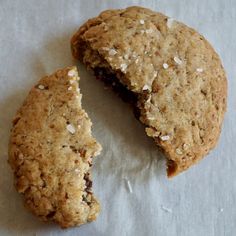 two oatmeal cookies are cut in half