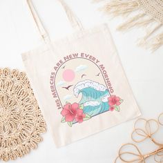 a tote bag sitting on top of a table next to some glasses and eyeglasses