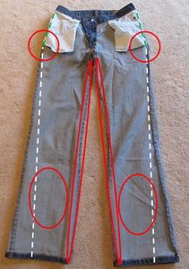 a pair of jeans with red circles on the side and white dots in the back