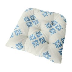 a blue and white pillow on a white background