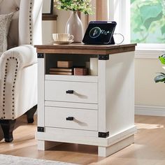 a white chair and table with a laptop on it