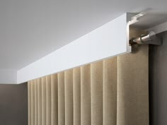 a close up view of a curtain with light coming from the top and below it