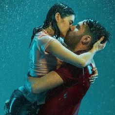 a man and woman are kissing under the water