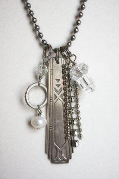 a necklace with several charms attached to it