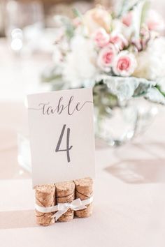 the table numbers are placed on wine corks