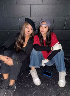 two young women sitting next to each other