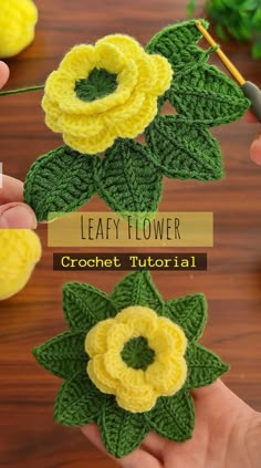 two crocheted flowers with leaves on them