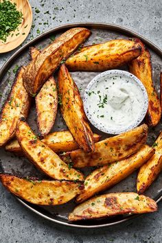 baked potato wedges with ranch dressing on a plate