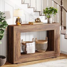 a wooden shelf with baskets and plants on it in front of a stair case next to a potted plant