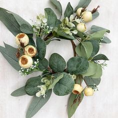 a wreath made out of leaves and flowers