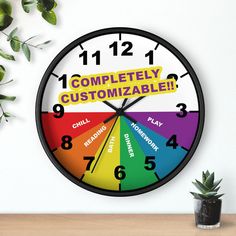 a clock with the words completely customizable on it next to a potted plant