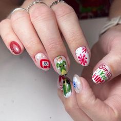 This playful design showcases Christmas classics like an elf, a snowflake, and a cheerful “Santa I know him” message on a crisp white background. With its bright and fun stickers, this look is perfect for bringing a sense of holiday humor and lighthearted cheer to the season. Each nail tells its own holiday story, adding a touch of whimsy. A Christmas Story Nails, Christmas Nails Fun, Christmas Character Nails, Nails With Stickers