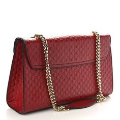 This is an authentic GUCCI Microguccissima Medium Emily Chain Shoulder Bag in Red. This chic shoulder bag is crafted of fine Gucci GG monogram embossed leather in deep red. The bag features a light gold chain link shoulder strap with red leather shoulder pad and a crossover flap secured by a strap adorned with leather tassels and a gold horse bit embellishment. The flap opens to a spacious natural fiber interior with patch pockets. Gold Horse, Small Messenger Bag, Gg Monogram, Vintage Monogram, Horse Bits, Gucci Shoulder Bag, Leather Tassel, Chain Shoulder Bag, Chain Bags