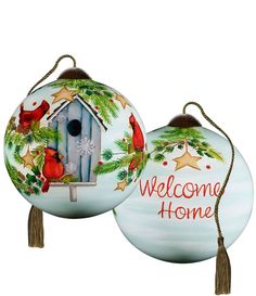 two christmas ornaments with the words welcome home and cardinal birdhouse on one ornament