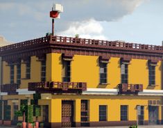 a large yellow building with balconies and windows