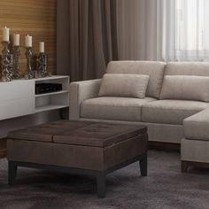 a living room scene with focus on the couch and ottoman