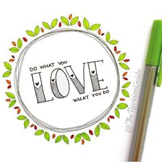 a green pen sitting on top of a paper with the words love written in it