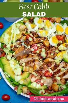 the best cobb salad with eggs, avocado and tomatoes on top is shown