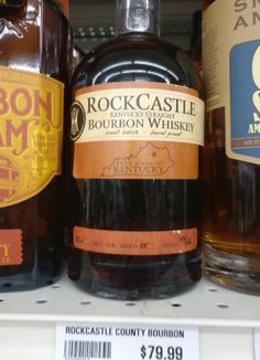 bottles of rock castle bourbon whiskey are on display for $ 79 99 at the store