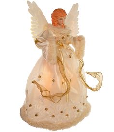 an angel figurine is shown on a white background