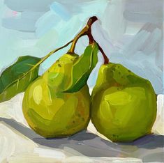 two green pears on a white cloth