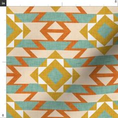 an orange, yellow and blue pattern on fabric