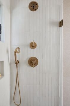 the shower head and handset are connected to the faucet in this bathroom