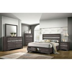 a bedroom scene with focus on the bed and dressers, mirror and nightstand unit