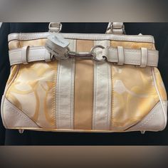 Brand New . Never Used. Original Price Tag Attached. Coated Canvas With Leather Trim. Zippers And Inside In New Condition. Color Is Light Yellow With Light Cream Leather Handles. No Discoloration (Just Shading While Taking Pictures). Will Ship In 1 Day Unless It’s A Weekend. Approx Dimensions- H = 8”, W = 12”, D =3 “ Coach Pillows, Y2k Boho, Vintage Coach Bags, Purse Brands, Barrel Bag, Mini Handbags, Black Purses, Mini Shoulder Bag, Leather Hobo