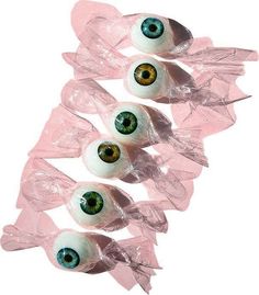 four plastic eyes are in the shape of candy