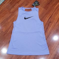 Nwt Nike Pro Dri-Fit Tank. It Has Cut Out At The Back And Mesh Panel Along Part Of Cut Out. Style Is Standard Fit. Color Is Between A Periwinkle And Lavender (Between Blue Shades And Purple Shades) Nike Purple Fitted Top, Fitted Nike Purple Tops, Nike Sports Tops In Purple, Nike Purple Tops For Sports, Nike Purple Sleeveless Tops, Periwinkle And Lavender, Purple Shades, Polo Women, Nike Fit