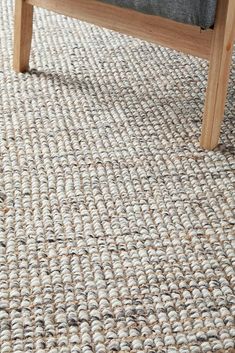 an upholstered bench sits on the carpet