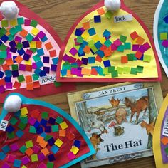 colorful paper plates with different colored papers on them and the words, the hat are made out of construction paper