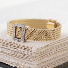 We love a jewel that is both beautiful and functional! We love how this mesh bracelet appears like any other bracelet out there but a quick flip of the lid opens to reveal a slender watch underneath. Chic, elegant, and a perfect addition to any jewelry wardrobe. 14kt yellow gold 6.7” in length, 24.9 pennyweights Diamonds are estimated H/I colors & VS clarities, GIA standards. Please see qualitative report for more information. Luxury Diamond Watch With Jubilee Bracelet For Evening, Elegant Rectangular Bracelet Strap Jewelry, Elegant Evening Diamond Watch With Bracelet Strap, Elegant Yellow Gold Bracelet With Diamond Hour Markers, Luxury Wedding Jewelry And Watches With Jubilee Bracelet, Luxury Jubilee Bracelet Jewelry For Evening, Luxury Jubilee Bracelet Jewelry For Wedding, Luxury Jubilee Bracelet For Wedding, Elegant Diamond Watch With Bracelet Strap